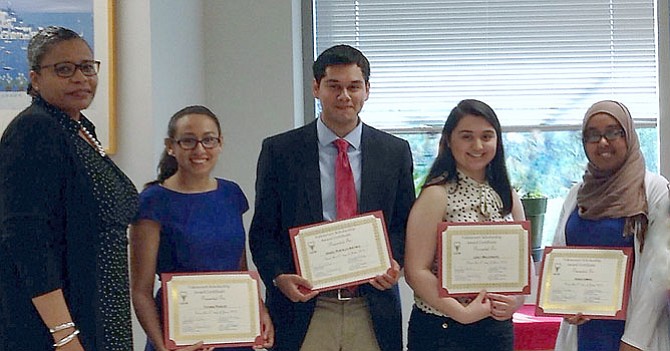 At the recent ceremony to announce UCM’s 2015 Lois Valencourt Scholarship Fund awardees are: (from left) Nichelle A. Mitchem, UCM Executive Director, and awardees Tatiana Robles (West Potomac High 2015), Israel Archila (Bryant Alternative High 2015), Lesly Maldonado (West Potomac High 2015), and Renas Emmad (Bryant Alternative High 2015).