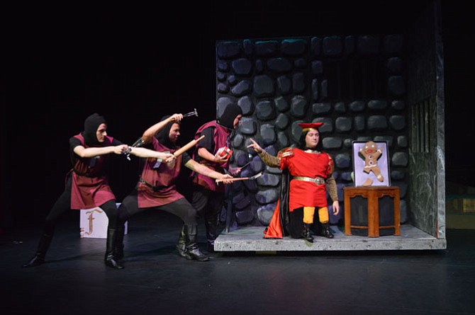 Farquaad (William Shingler) and his guards (from left to right, Mark Zubaly, Josh Conrad, and Angus Long) interrogate Gingy (Irene Marinko) appear in the musical theatre adaptation of popular children’s movie and book, “Shrek,” about an ogre on a journey to rescue a princess. The show  will complete its run at Thomas Jefferson Community Theatre, 125 S Old Glebe Road this weekend. Local youth theatre company Encore Stage & Studio will perform Thursday-Friday, July 23-24, at 7:30 p.m. and Saturday-Sunday, July 25-26 at 2 p.m. Tickets are $15 for adult and $12 for children, students, military and seniors. Visit www.encorestage.org. 