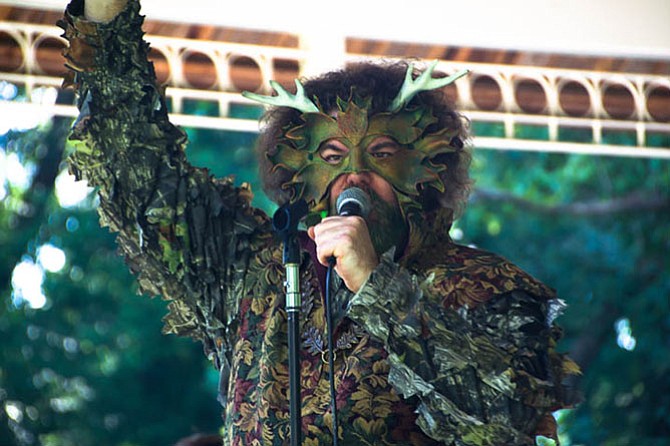 Vocalist and percussionist Stephan Winick dresses up for OCEAN’s song, “Greenman.”
