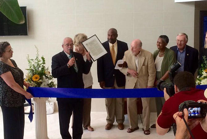 A grand opening ceremony for the Robert E. Simon, Jr. Children's Center was held on Saturday, July 18. The preschool is located at 12005 Sunrise Valley Drive in suite 120 in Reston. Holding the microphone is U.S. Congressman Gerry Connolly.
