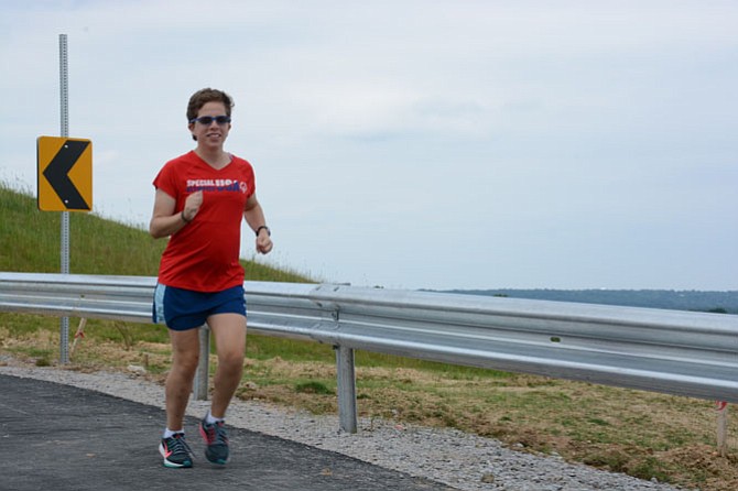 Karen Dickerson goes for a quick jog after getting off work at the new Alexandria Wegmans grocery store.