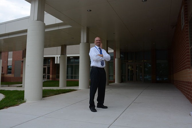 Terra Centre principal Greg Brotemarkle shows off the new Kiss-n-ride entrance to the Burke elementary school.