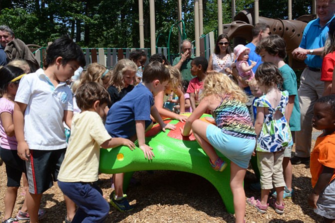 Olde Forge-Surrey Square children help unveil the freshly redecorated turtle, a remnant from the original Surrey Square Park playground.