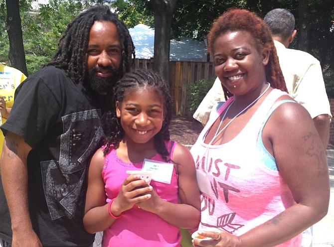 From left: Jerry Blake, Jay’den Cathey and Jolonda Davis attended My Brother’s Keeper on July 25 and stood in line for Jay’den’s free medical screening. She will be a third grader in the fall. 