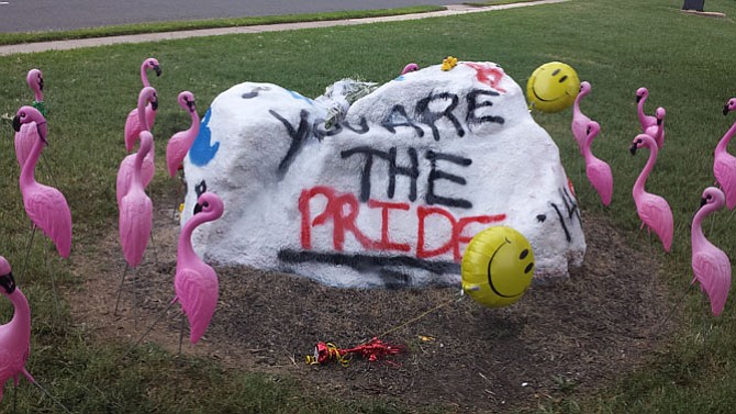 Herndon High School’s trademark rock in the front lawn reads: Holly, Kyle, Dale: You are THE PRIDE.