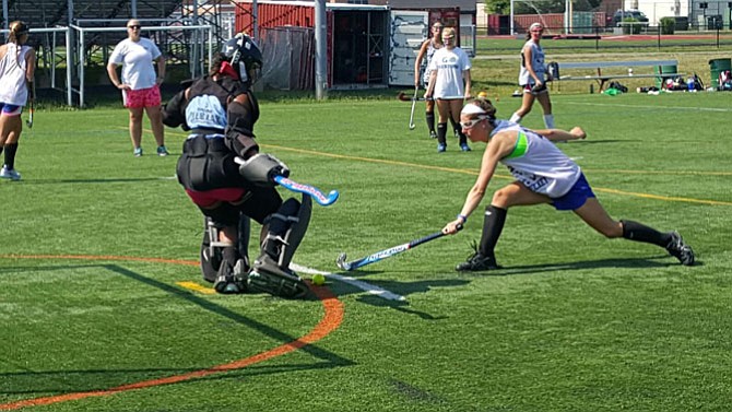 Rising junior midfielder/defender Grace Caron, right, and rising senior goalkeeper Jessica Corum are two of the Herndon field hockey team’s top returners.