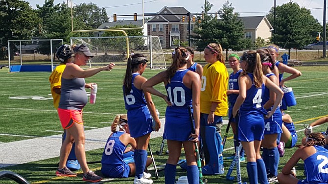 South Lakes head coach Allison Woron, left, talks to the Seahawks during the Under the Lights tournament at Lee High School.