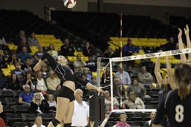 Madison outside hitter Natale Zanellato, seen during the 2014 state tournament, returns for her senior season after helping the Warhawks finish 6A state runner-up.