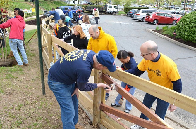 Business, civic and service organizations provide a way to meet people and give back to the community. Here, members of the West Alexandria Rotary Club gather to help spruce up John Ewald Park.
