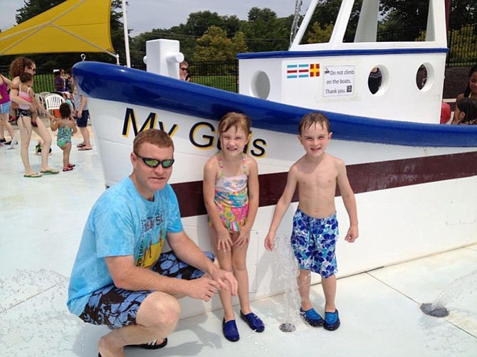 Supervisor McKay, daughter Leeann, and friend at the spraypark.
