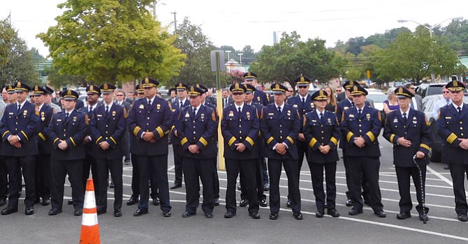 Officers wait outside the funeral home after Sgt. Lindenbaum’s service.
