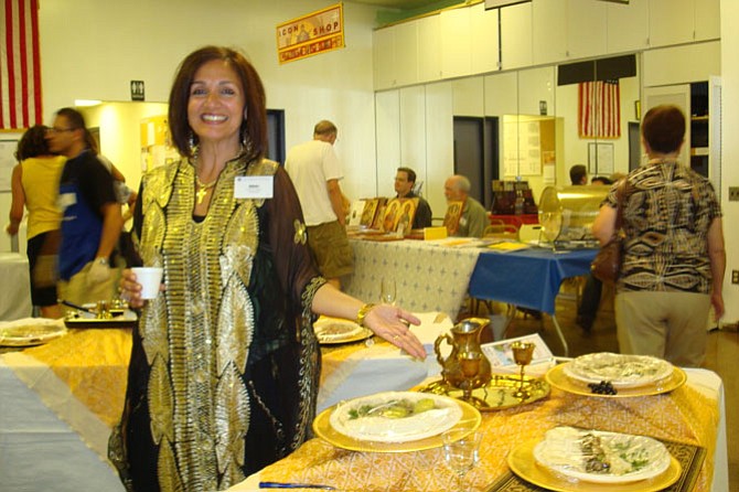 Nikki Haddad points to some of the Middle Eastern dishes for sale at Holy Transfiguration Melkite Greek-Catholic Church’s annual Middle Eastern Food Festival running over Labor Day weekend.
