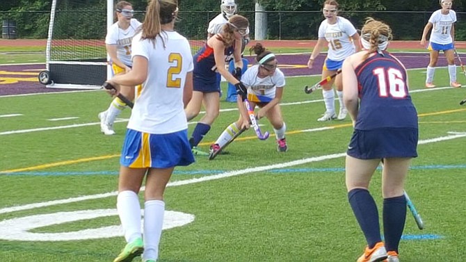 Robinson senior Katie O’Loughlin, middle, moved from forward to defensive midfielder this season.