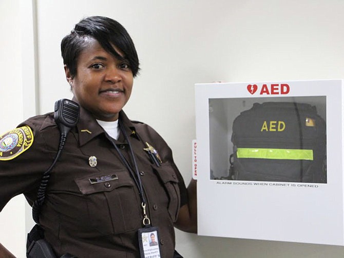 Deputy Gloria Wright with the AED on the rhird floor of the Alexandria Courthouse.
