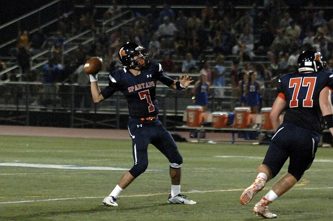 West Springfield quarterback Peter Muskett threw four touchdown passes and ran for a score during the Spartans' 35-28 win over Robinson on Friday.