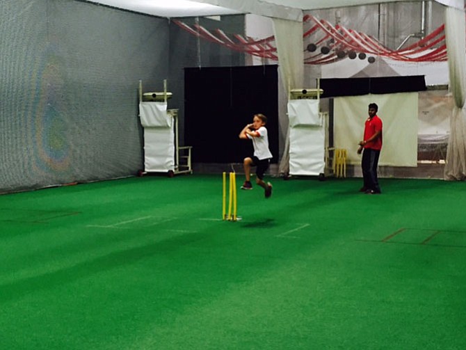 Nate Garland lifts off as he bowls.
