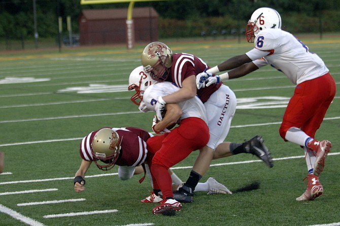 The Oakton defense held T.C. Williams to 36 yards of offense and two first downs during the Cougars’ 24-0 victory on Friday.