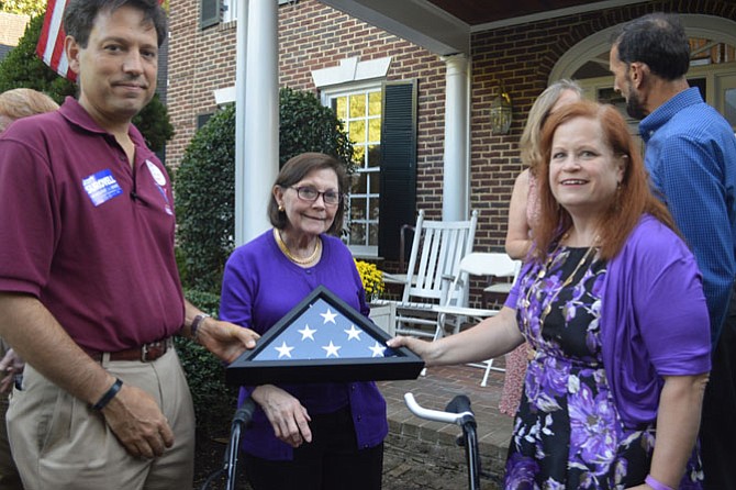 Retiring state Sen. Linda “Toddy” Puller (center) was presented with a flag flown over the Mt. Vernon Estate by Mt. Vernon District Democratic Committee chair Kate Spears (right) and Del. Scott Surovell (44th) who is running for Puller’s seat with her endorsement.
