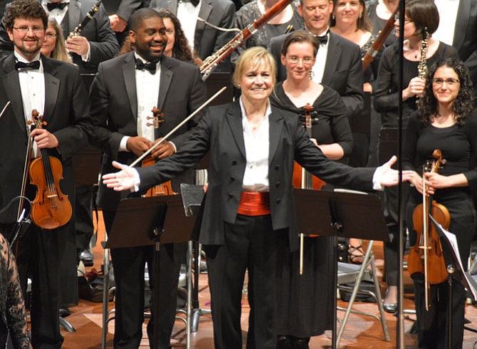 Miriam Burns is the orchestra’s conductor and musical director. “One of my favorite things is to introduce people to a piece for the first time,” she said.