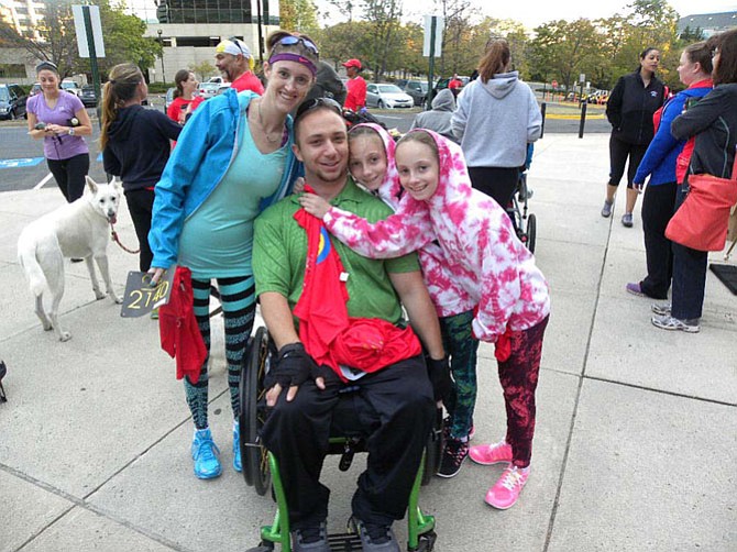 Jesse Graham, of Bristow, Va., with wife Bobbie and twin daughters Makaylee and Madisen, 9. Graham broke his neck in a snowboarding accident 18 months ago.