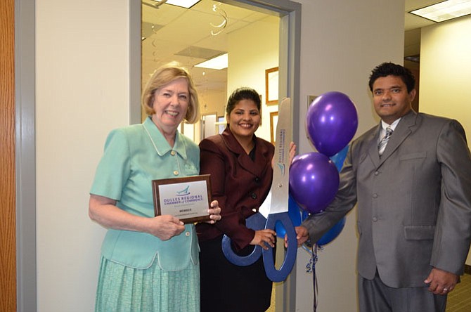 Eileen Curtis, president of Dulles Regional Chamber of Commerce, welcomes Pinky Khatri, doctor of audiology, and her husband Pradeep Khatri.
 
