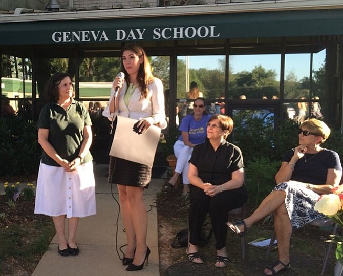 Iman Awad, an administrative director from Gov. Larry Hogan’s office presents a citation to Geneva Day School Director Suzanne Funk. Seated (from left) are Assistant Director Amanda White (rear), the Rev. Anne Benefield, Geneva Presbyterian Church, and Renee Moloznik, president of the Geneva Day School board of directors.
