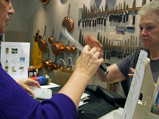 Pamela Simon has driven in from Laurel, Md., with eight Henckel knives to be sharpened and to pick up an order of specialty cocoa. She said, “Working here would be my dream job.”
