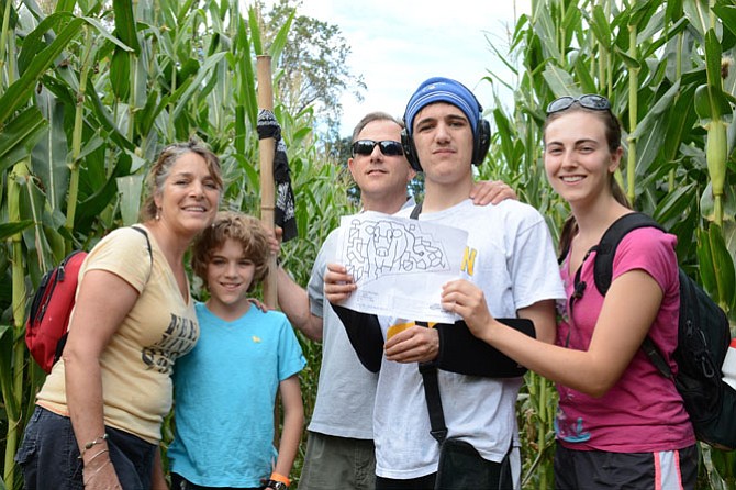 (From left) Sara, Johnathan, Rick and Ben Breaux of Fairfax and Catherine Saliba of Manassas embark on the corn maze at the Whitehall Farms Fall Fun Days.
