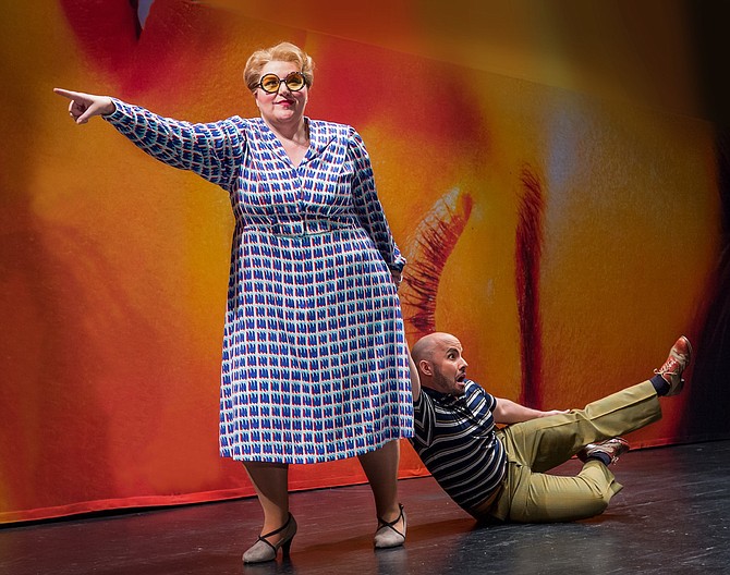 Margaret Gawrysiak as Public Opinion and Javier Abreu as Orpheus in Virginia Opera’s production of "Orpheus in the Underworld."
