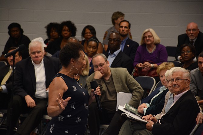 Commissioner Shirley Ginwright, chairman, Communities of Trust Committee and president of the Fairfax County chapter of the National Association for the Advancement of Colored People, responds to protesters for Natasha McKenna at the public forum of the Fairfax County police practices review commission.
