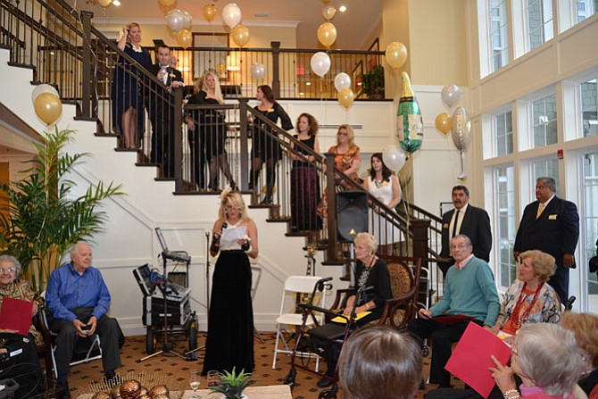 Brightview Great Falls executive director Tina Aulakh gave the welcome speech and made the toasts, surrounded by her staff on the stairs above her. Then it was on to leading the gathering in a few rousing tunes before getting the dancing underway.
