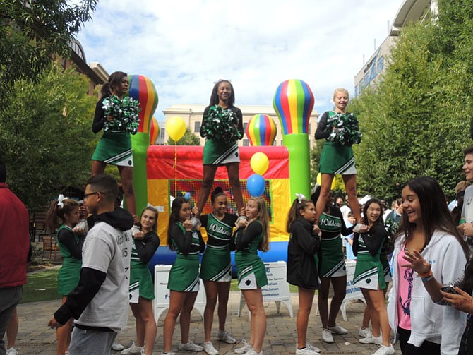 Walter Johnson cheerleaders salute the crowd of walkers.
