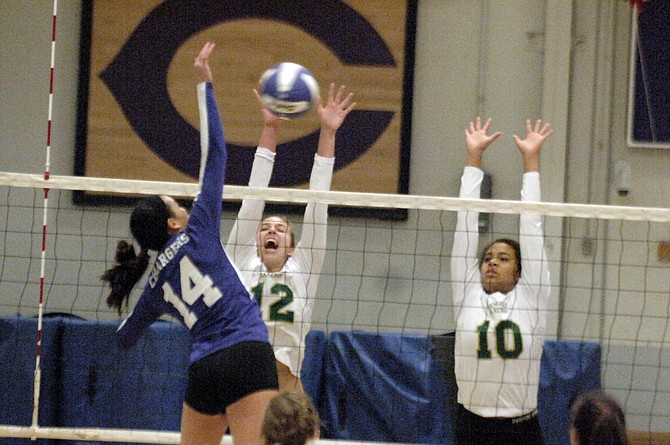 Langley’s Elena Shklyar (12) and Katie Sissler attempt to block Chantilly’s Julia Recto on Monday.