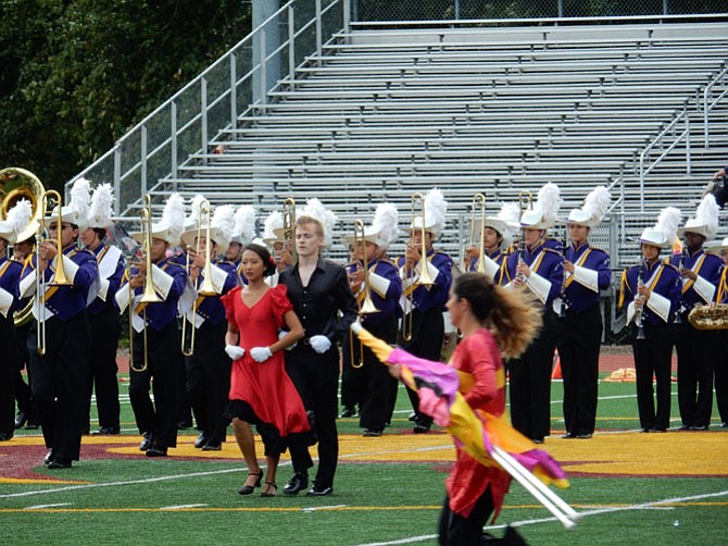 Drum majors – Elizabeth Lee is left, wearing a salsa dress – stood in the center before the performance begins. Audience cheered and gave a round of applause when the two drum majors showed salsa steps.