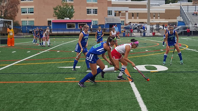 Churchill's Faith Kean, left, defends Wootton's Rachel Maizel.