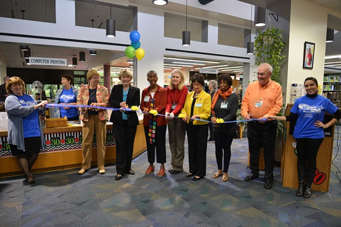 Cutting the ribbon in celebration of Reston Regional Library’s 30th birthday from left: Sharon Harmon, event co-chair, Roxanne Hughes, vice president Friends of Reston Regional Library, state Sen. Janet Howell (D-32), Supervisor Cathy Hudgins (D-Hunter Mill), Pat Hynes, Hunter Mill School Board member, Board of Supervisors Chairman Sharon Bulova, library director Sam Clay, and America Reichel, event co-chair.