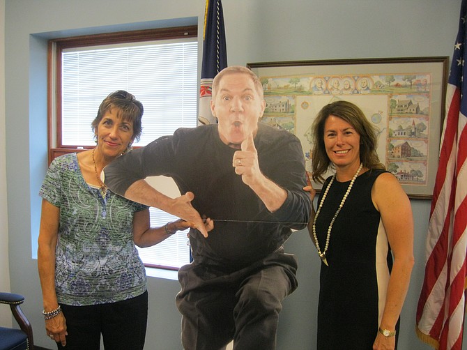 Shepherd’s Center of Oakton-Vienna Director Michelle Scott and Vienna Mayor Laurie diRocco spend a moment with “flat Mack,” a cut-out image of Mack Dryden, nationally-known headliner for SCOV’s annual benefit fundraiser on Oct. 26.