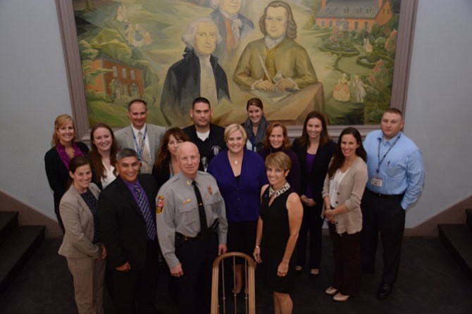 Members of the Fairfax County Police Department, Department of Family Services, Office for Women and Domestic Violence Services, and domestic violence detectives gathered at the Historic Fairfax Courthouse to mark the launch of a new Lethality Assessment Program for victims of domestic violence. 