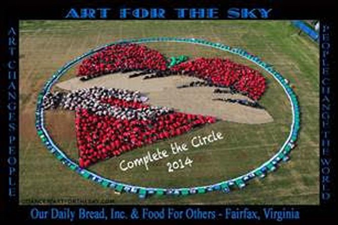 Art for the Sky Photo taken from 80 feet above by Artist Daniel Dancer at the 2014 Complete the Circle FoodRaiser. The perimeter of the circle is food and pantry donations, and the "heart" and "hand" images are the people. 