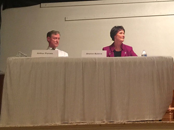 Sharon Bulova (D) and Arthur Purves (R) listen to Ralph Appleton’s question at a debate at the Great Falls Citizens Association. The chairman of the Board of Supervisors is the only position on the board elected at-large.
