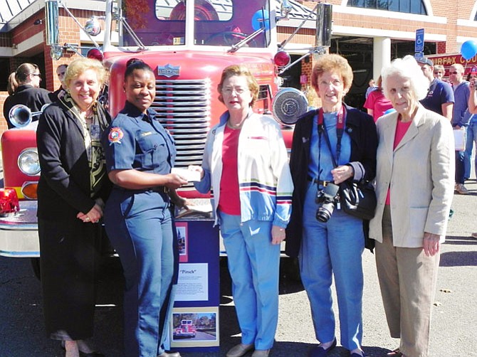 President Joan Morton, of the McLean Woman’s Club, presents a check for $1,500 to Yolanda DeMark, Captain II, commander of the McLean Fire Station. From left: Woman’s Club First Vice President Cecilia Glembocki, Station Commander Yolanda DeMark, Woman’s Club President Joan Morton and Woman’s Club members Laura Sheridan and Grace Harkins.