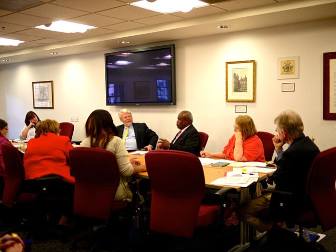 Dan Hawkins, chair of the Mayor's Special Advisory Panel on the Health Needs of the Uninsured in Alexandria, with Mayor William Euille and members of the panel at a meeting in June. 
