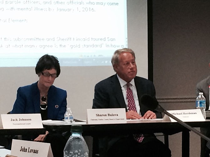 Michael Hershman, chairman of the police commission, with Sharon Bulova at the final meeting of the full commission before recommendations go to the Board of Supervisors on Oct. 20.