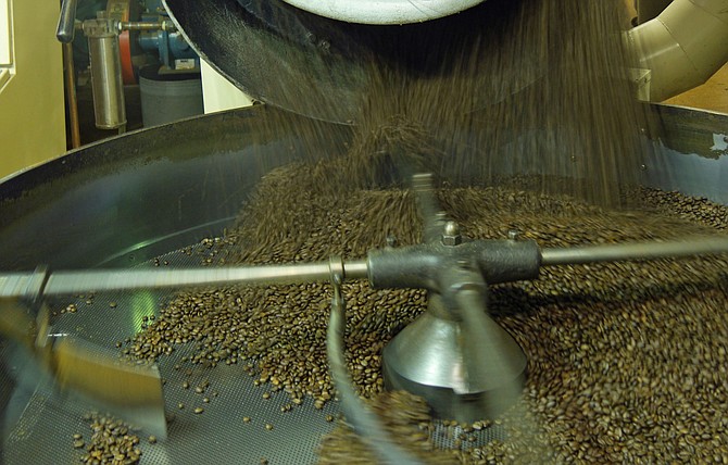 One hundred pounds of Sumatran coffee beans have just bounced from the roaster to the cooling pan at Swing’s Coffee Roasters in Del Rey. The air draws down to cool the beans in a few minutes before they go up the hopper to the storage bin. 
