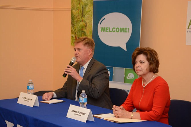 Supervisor John Cook (R-Braddock, left) and Janet Oleszek (right) answer questions at the League of Women Voters of Fairfax meet the candidates event Oct. 8. Oleszek is challenging Cook for the supervisor position.