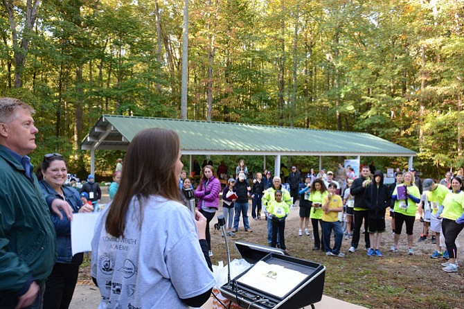 Organizer Shannon Duncan (center) congratulates runners on completing the Decoding Dyslexia 5K Run for Dyslexia.