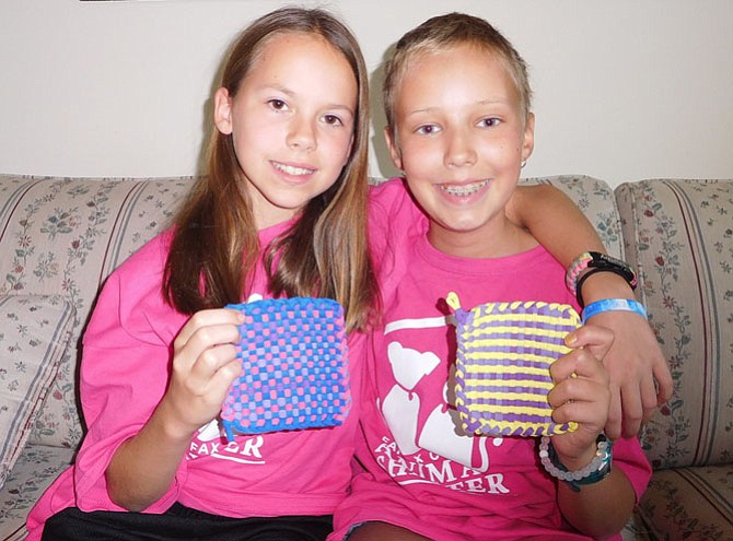 From left, Shelby Mysel and Tara Sankner show their handmade potholders and coasters.