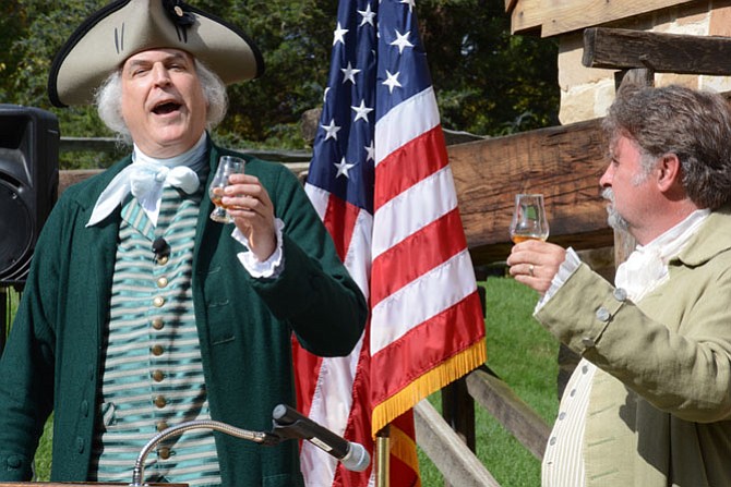 General George Washington (left) and his farm manager James Anderson (right) toast to the completion of a new Single Malt at the gristmill distillery and celebrate continued collaboration and camaraderie with Scotland.