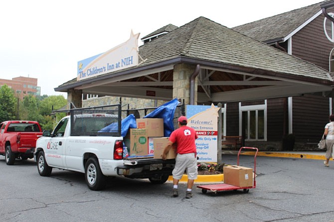 Mario Reyes of Case unloads and delivers donated food to the Children’s Inn at the National Institutes of Health.
