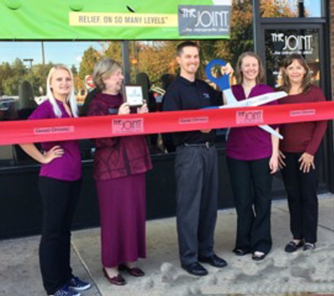 The Joint Chiropractic ribbon cutting at Greenbriar Town Center. From left: Tracy Gilbert, Wellness coordinator, The Joint; Eileen Curtis, president & CEO, Dulles Regional Chamber of Commerce; Jarod Rehmann, DC and Becky Rehmann, DO, co-owners, The Joint; Susan Banville, Chamber representative. 
